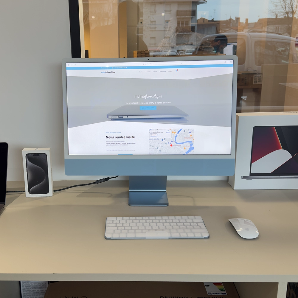 Nouvel iMac M3 affichant un écran Retina 5K éclatant, vu de face, avec un design minimaliste et des couleurs vibrantes à l'écran.