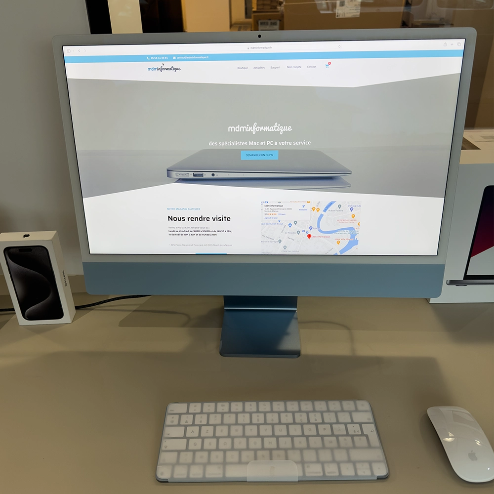 iMac M3 dernier modèle posé sur un bureau élégant, avec son écran Retina affichant des graphiques vibrants, idéal pour les professionnels créatifs et le travail de bureau